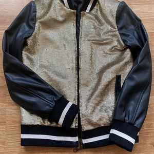 Woman black and gold leather jacket